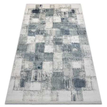 Covor geometric modern albastru cu ciucuri, ideal pentru decorul livingului